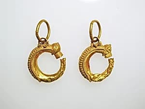 Earrings, trumpet-shaped by Unknown Artist