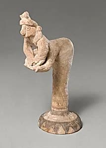Female figurine kneading dough(?) by Unknown Artist