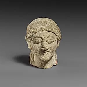 Female limestone head by Unknown Artist