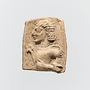 Fragment of a terracotta plaque by Unknown Artist
