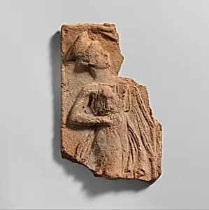 Fragment of a terracotta plaque by Unknown Artist