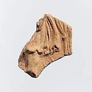 Fragment of a terracotta plaque by Unknown Artist
