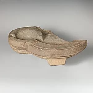 Fragmentary stone oil lamp by Unknown Artist
