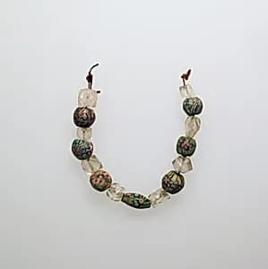 Glass and rock crystal beads by Unknown Artist