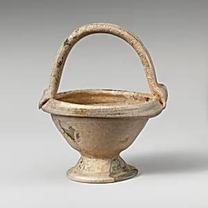 Glass bowl with basket handle by Unknown Artist