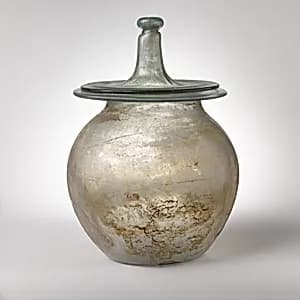 Glass cinerary urn with lid by Unknown Artist