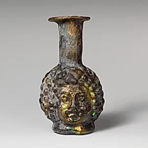 Glass double head-shaped bottle by Unknown Artist