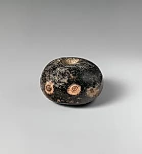 Glass eye bead by Unknown Artist