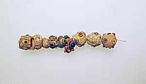 Glass eye beads by Unknown Artist
