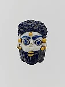 Glass face bead by Unknown Artist