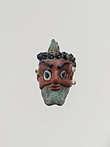 Glass head pendant by Unknown Artist