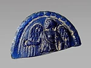 Glass medallion of winged Victory by Unknown Artist