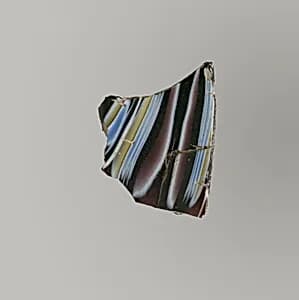 Glass mosaic ribbed bowl fragment by Unknown Artist