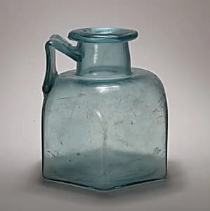Glass one-handled hexagonal bottle by Unknown Artist