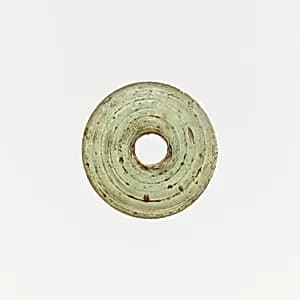 Glass spindle whorl by Unknown Artist