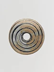 Glass spindle whorl by Unknown Artist