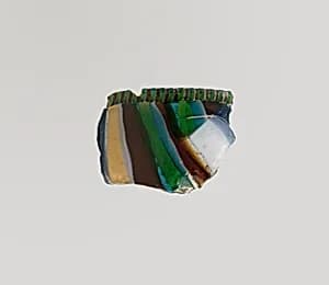 Glass striped mosaic bowl fragment by Unknown Artist