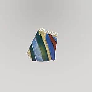 Glass striped mosaic bowl fragment by Unknown Artist