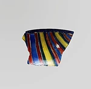 Glass striped mosaic bowl fragment by Unknown Artist