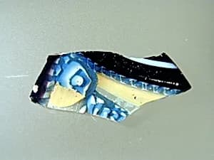 Glass striped mosaic bowl fragment by Unknown Artist