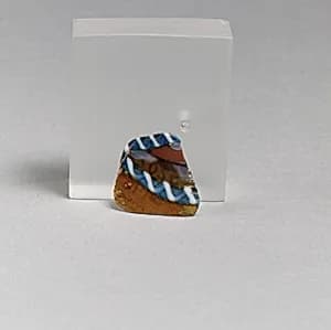 Glass striped mosaic bowl fragment by Unknown Artist