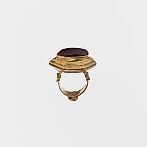 Gold and cabochon garnet ring by Unknown Artist