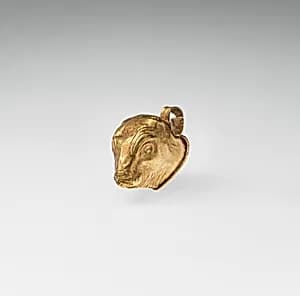 Gold calf-head pendant by Unknown Artist