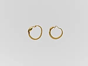 Gold earring with convex disc by Unknown Artist