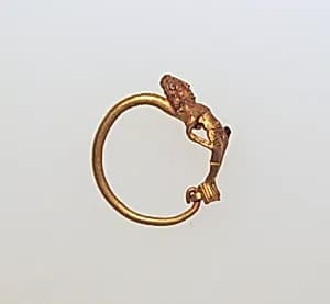 Gold earring with figure by Unknown Artist