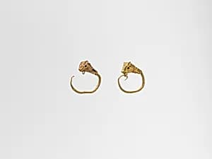 Gold earring with head of a bull by Unknown Artist
