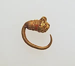 Gold earring with head of a lion by Unknown Artist