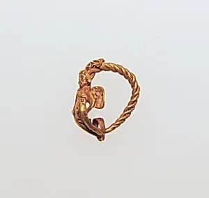Gold earring with winged Eros by Unknown Artist