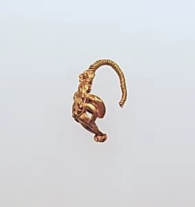 Gold earring with winged figure by Unknown Artist