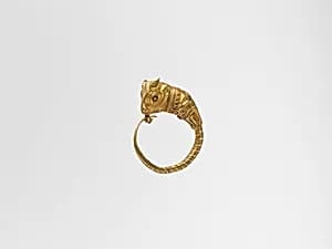 Gold earrings with bull's head by Unknown Artist