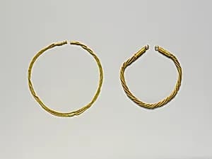 Gold necklace of linked strands by Unknown Artist
