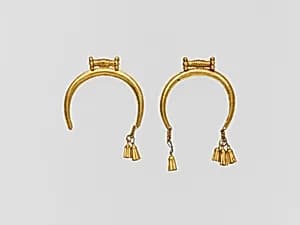 Gold pendant with tassels by Unknown Artist