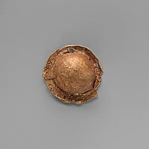 Gold roundel of bulbous form by Unknown Artist