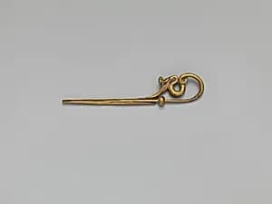 Gold serpentine fibula (safety pin) by Unknown Artist