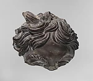Greywacke head of a satyr by Unknown Artist