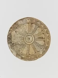 Ivory disk with rosette by Unknown Artist