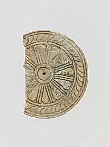 Ivory disk with rosette by Unknown Artist