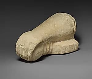 Limestone arm holding a sword by Unknown Artist