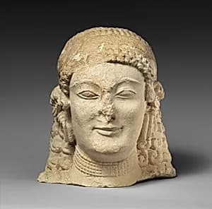 Limestone female head by Unknown Artist