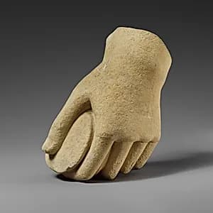 Limestone hand holding a pyxis by Unknown Artist