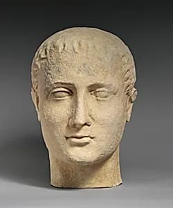 Limestone head of a beardless male votary by Unknown Artist