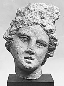 Limestone head of a girl by Unknown Artist