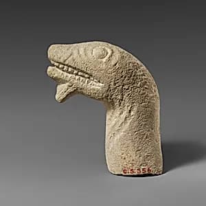 Limestone head of a snake by Unknown Artist