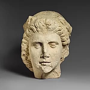 Limestone head of Apollo by Unknown Artist