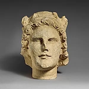 Limestone head of Apollo by Unknown Artist
