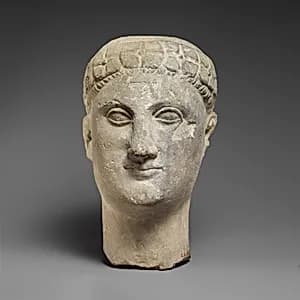 Limestone male head by Unknown Artist